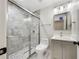 Modern bathroom featuring a tiled shower with a glass door and a sleek vanity at 617 Kyles Cir, Hiram, GA 30141
