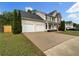 Charming two-story home with a two-car garage and well-manicured lawn at 617 Kyles Cir, Hiram, GA 30141