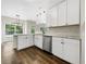 Well-lit kitchen featuring white cabinets, stainless steel appliances, and an island at 617 Kyles Cir, Hiram, GA 30141
