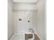 Laundry room features tile floors and a wire shelf above the hookups at 617 Kyles Cir, Hiram, GA 30141
