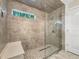 Modern shower with tiled walls, a glass enclosure, and built-in bench seating at 617 Kyles Cir, Hiram, GA 30141