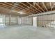 Unfinished basement with exposed framing, ductwork, and a concrete floor ready for customization at 7620 Breeze Bay Rd, Cumming, GA 30041