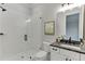 Modern bathroom featuring a glass-enclosed shower, white subway tile, and a vanity with dark countertop at 7620 Breeze Bay Rd, Cumming, GA 30041