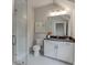 Clean bathroom with glass-enclosed shower, a toilet, and a vanity with storage at 7620 Breeze Bay Rd, Cumming, GA 30041