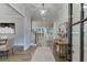 Inviting foyer with hardwood floors, elegant lighting, artwork, and an open view to the living areas at 7620 Breeze Bay Rd, Cumming, GA 30041