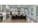 Modern kitchen with stainless steel appliances, a center island with seating, and ample counter space at 7620 Breeze Bay Rd, Cumming, GA 30041