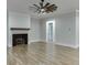Spacious living room with fireplace and hardwood floors creates a cozy and inviting atmosphere at 7620 Breeze Bay Rd, Cumming, GA 30041