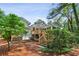Exterior backyard with multiple decks, landscaping, and beautiful mature trees at 88 Karland Nw Dr, Atlanta, GA 30305