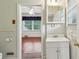 Bathroom showcasing a vanity and a glimpse into the adjacent bedroom at 88 Karland Nw Dr, Atlanta, GA 30305