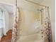 A bathroom featuring a bathtub and shower with a seashell themed curtain at 88 Karland Nw Dr, Atlanta, GA 30305