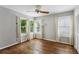 Cozy bedroom with hardwood floors, three windows, and light curtains for bright natural light at 88 Karland Nw Dr, Atlanta, GA 30305