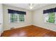 Bedroom with hardwood floors and two windows with decorative window treatments at 88 Karland Nw Dr, Atlanta, GA 30305