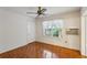 Bedroom showcasing a ceiling fan, hardwood floors, and an air conditioner unit at 88 Karland Nw Dr, Atlanta, GA 30305