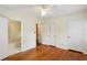 Bedroom with hardwood floors and three closets including a view of the bathroom at 88 Karland Nw Dr, Atlanta, GA 30305