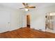Primary bedroom featuring hardwood floors, an ensuite bathroom, and two large closets at 88 Karland Nw Dr, Atlanta, GA 30305