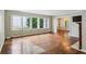 Bright living room boasts hardwood floors, large windows, and a seamless transition to the dining area at 88 Karland Nw Dr, Atlanta, GA 30305
