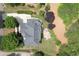Expansive aerial view of a gray roofed house showcasing the backyard patio and well-manicured lawn at 2020 Windermere Xing, Cumming, GA 30041