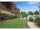 Well-maintained backyard with lush green lawn and spacious patio area at 2020 Windermere Xing, Cumming, GA 30041