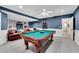 Basement area featuring a pool table, leather sofa, recessed lights, and wainscotting at 2020 Windermere Xing, Cumming, GA 30041