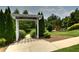 Inviting entrance to Southgate Park with arbor, lush greenery, and walking path at 2020 Windermere Xing, Cumming, GA 30041
