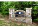Stone sign for Windermere Park with lush greenery in the background at 2020 Windermere Xing, Cumming, GA 30041