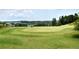Scenic view of the golf course with manicured greens and mature trees at 2020 Windermere Xing, Cumming, GA 30041