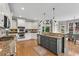 Modern kitchen featuring granite countertops, stainless steel appliances, and a stylish center island at 2020 Windermere Xing, Cumming, GA 30041
