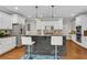 Well-designed kitchen with island seating, stainless steel appliances, and white cabinets at 2020 Windermere Xing, Cumming, GA 30041