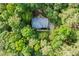 A bird's-eye view of a secluded home surrounded by mature trees and lush greenery at 525 Watergate Ct, Roswell, GA 30076