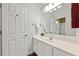 Well-lit bathroom features a white vanity, framed mirror, white cabinets, and a walk-in shower at 525 Watergate Ct, Roswell, GA 30076