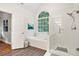 Bathroom featuring a glass door shower and large soaking tub at 525 Watergate Ct, Roswell, GA 30076