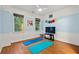 Large bedroom with blue accent walls, two windows, and a ceiling fan at 525 Watergate Ct, Roswell, GA 30076