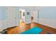 Large bedroom with light blue accent walls and hardwood flooring at 525 Watergate Ct, Roswell, GA 30076