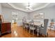 Dining room with elegant wainscoting, contemporary lighting, and views of the kitchen at 525 Watergate Ct, Roswell, GA 30076