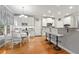 Bright eat-in kitchen with breakfast bar, dining area, stainless appliances, and granite counters at 525 Watergate Ct, Roswell, GA 30076