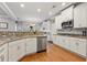 Spacious kitchen features granite countertops, stainless appliances, and generous cabinet space at 525 Watergate Ct, Roswell, GA 30076