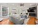 Inviting living room with a fireplace, large windows, and ample seating at 525 Watergate Ct, Roswell, GA 30076