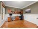Well-lit home office with custom built-ins, wainscoting, and a large window at 525 Watergate Ct, Roswell, GA 30076
