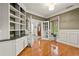 Comfortable office space with an exterior view and custom shelving providing ample storage at 525 Watergate Ct, Roswell, GA 30076