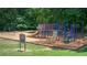 Outdoor community playground area featuring slides, swings, and climbing structures at 525 Watergate Ct, Roswell, GA 30076