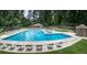 Large community pool with lounge chairs and umbrellas provides a relaxing resort-style experience at 525 Watergate Ct, Roswell, GA 30076