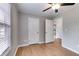 Bedroom featuring hardwood floors, neutral paint and a ceiling fan at 159 Cranbrooke Dr, Dallas, GA 30157