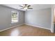 Cozy bedroom featuring wood floors and a window at 159 Cranbrooke Dr, Dallas, GA 30157