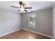 Bedroom with hardwood floors, ceiling fan and natural light from the window at 159 Cranbrooke Dr, Dallas, GA 30157