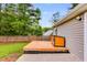 View of the wooden deck and a charming dog house in the backyard at 159 Cranbrooke Dr, Dallas, GA 30157