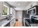 Modern kitchen with stainless steel appliances, and ample counter space at 159 Cranbrooke Dr, Dallas, GA 30157
