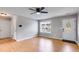 Spacious living room featuring wood floors, a ceiling fan, and neutral paint at 159 Cranbrooke Dr, Dallas, GA 30157