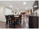 Basement has bar seating adjacent to seating area, refrigerator, and bar at 2460 Due West Nw Cir, Kennesaw, GA 30152