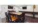 Basement bar seating area with chairs is illuminated by recessed ceiling lights at 2460 Due West Nw Cir, Kennesaw, GA 30152