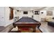 Basement game room featuring a pool table, entertainment center, and hardwood floors at 2460 Due West Nw Cir, Kennesaw, GA 30152